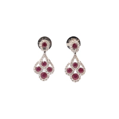 Lot 189 - An attractive pair of 18k white gold ruby and diamond set pendant stud earrings.