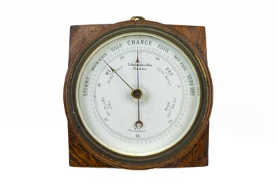 Lot 137 - An oak aneroid Barometer.