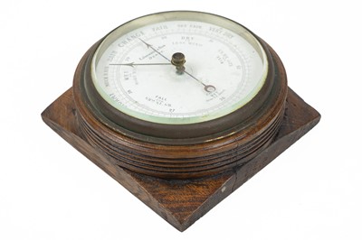 Lot 137 - An oak aneroid Barometer.