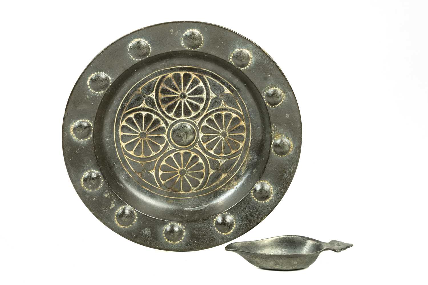 Lot 94 - A cast metal alms dish, tin alloy.