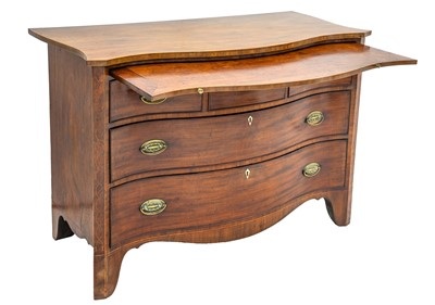 Lot 800 - A George III mahogany serpentine fronted chest with brushing slide.