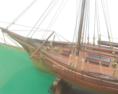 Lot 489 - A scale model of a schooner in a glazed case.