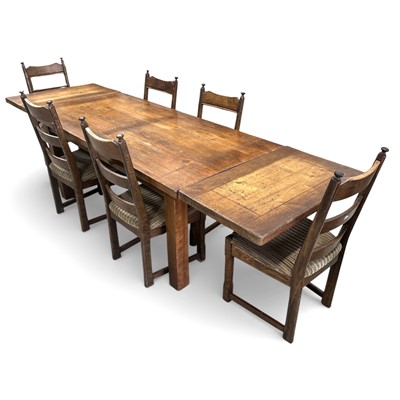 Lot 1 - An elm extending refectory table and six oak...