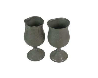 Lot 75 - A 19th century pewter communion set.