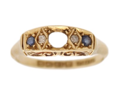 Lot 208 - An early 20th century 18k diamond and sapphire set four stone ring.