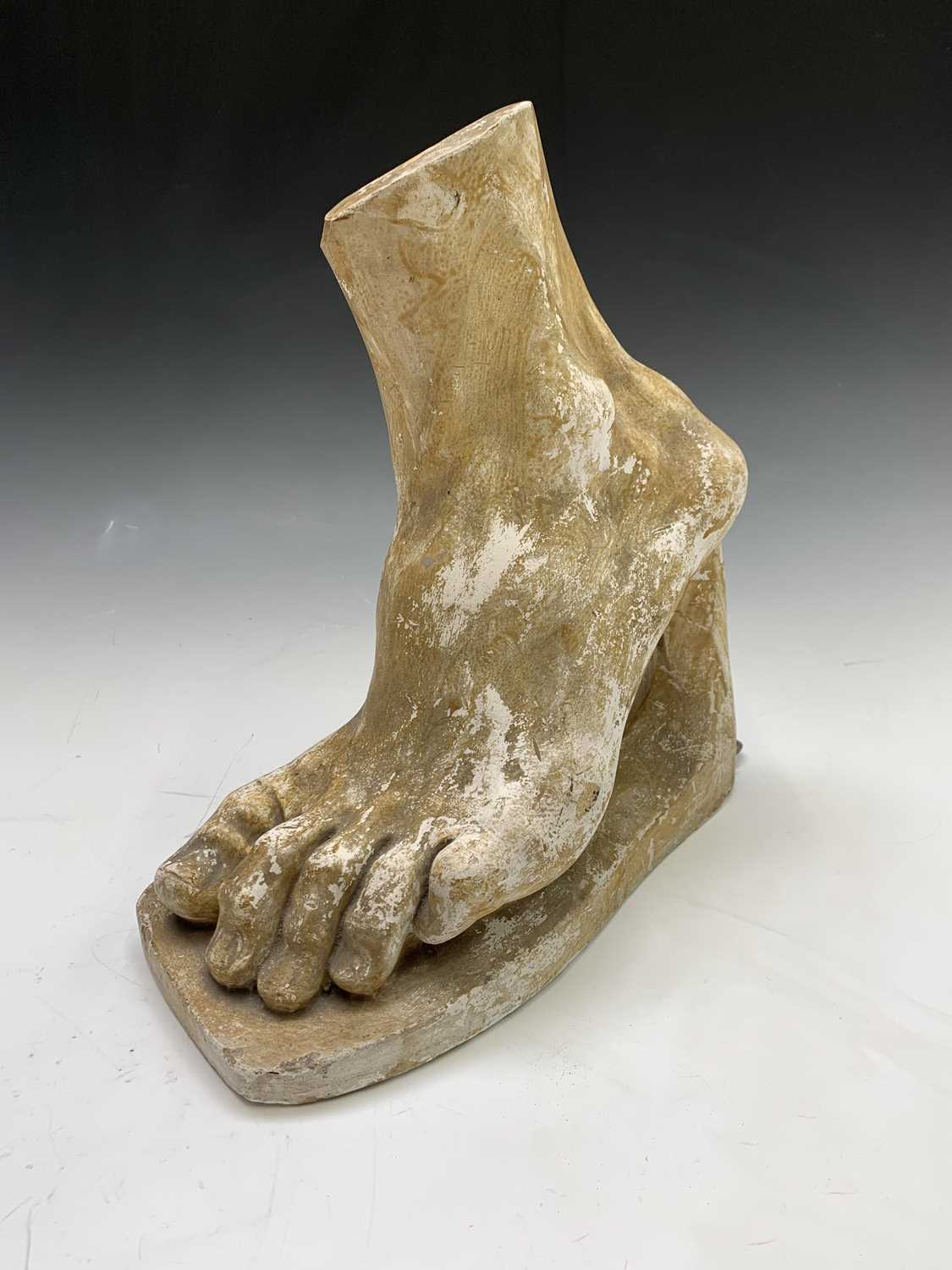 Lot 2 - A plaster cast sculpture of a foot, after the...