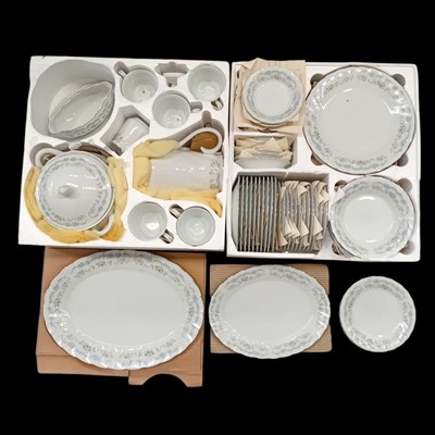 Lot 22 - A twelve-place setting dinner service,...