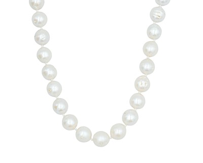 Lot 294 - A contemporary large cultured pearl necklace, strung to a silver diamond-set lobster claw clasp.