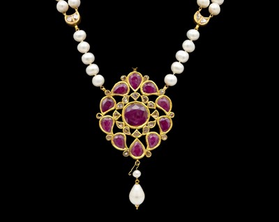 Lot 286 - A traditional Indian high-purity gold, diamond and ruby kundan-set pendant, on a pearl necklace.