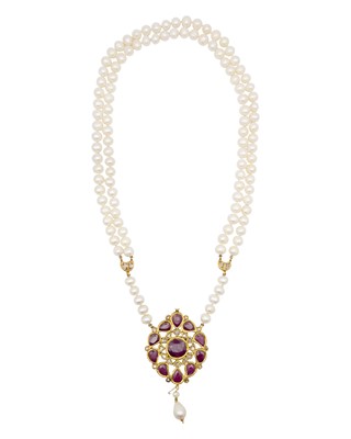 Lot 286 - A traditional Indian high-purity gold, diamond and ruby kundan-set pendant, on a pearl necklace.