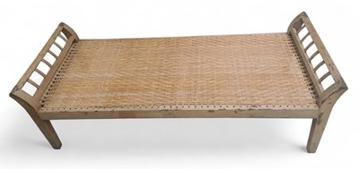 Lot 913 - A hardwood and rattan day bed.