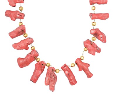 Lot 285 - An impressive and large stick coral and gold-plated bead necklace.