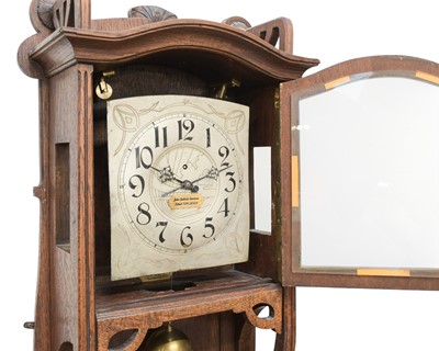 Lot A rare weight driven torsion wall clock, labelled John Baptiste Rombach.