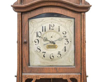 Lot A rare weight driven torsion wall clock, labelled John Baptiste Rombach.