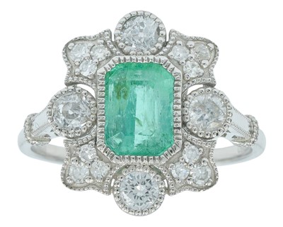 Lot 149 - An Art Deco platinum emerald and diamond set dress ring.