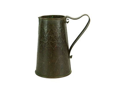 Lot 38 - An Arts and Crafts copper ale jug with repousse heart decoration.