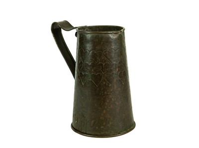 Lot 38 - An Arts and Crafts copper ale jug with repousse heart decoration.