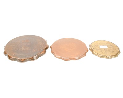 Lot 38 - An Arts and Crafts copper ale jug with repousse heart decoration.