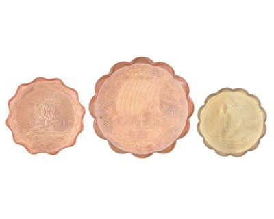 Lot 38 - An Arts and Crafts copper ale jug with repousse heart decoration.