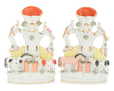 Lot 623 - A pair of Victorian Staffordshire spill vases.