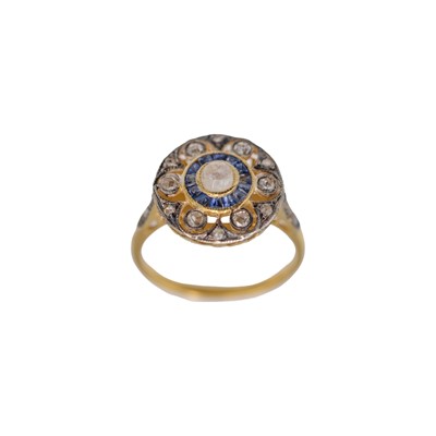 Lot 169 - An Art Deco style silver-and silver-gilt diamond and sapphire set ring.