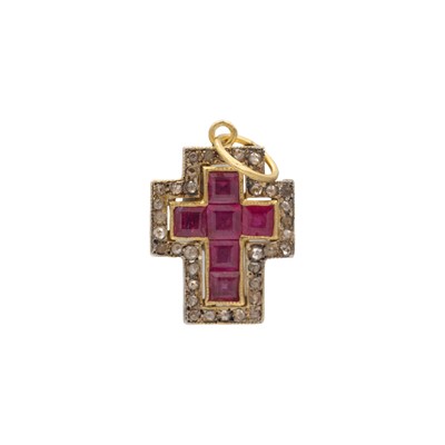 Lot 178 - A silver and silver-gilt diamond and ruby set cross pendant.
