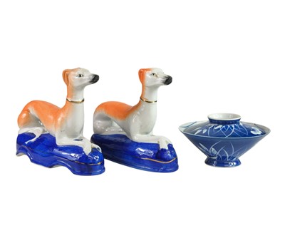 Lot 591 - A pair of Staffordshire style greyhound ornaments.