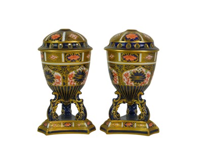 Lot 552 - A pair of Royal Crown Derby pot pourri jars and covers.