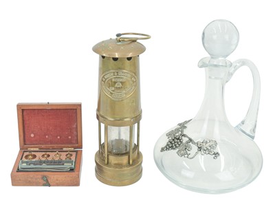 Lot 43 - A brass miner's lamp by E Thomas & Williams Ltd.