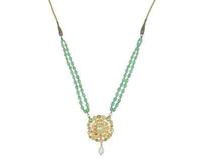 Lot 293 - An Indian high-purity gold, diamond and emerald kundan pendant, on an emerald bead necklace.