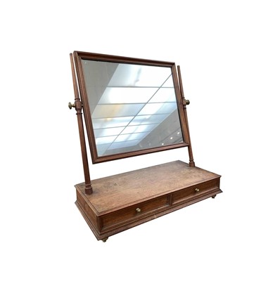 Lot 876 - A late Victorian walnut swing mirror.