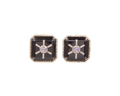 Lot 242 - A pair of black onyx, diamond and tanzanite earrings, set in silver.