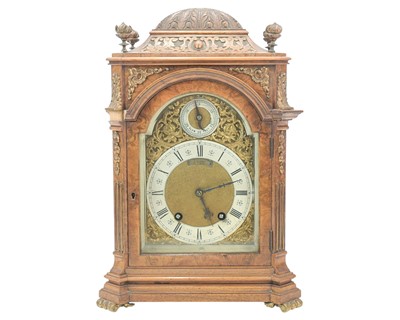 Lot 771 - A late Victorian figured walnut eight day German mantel clock.