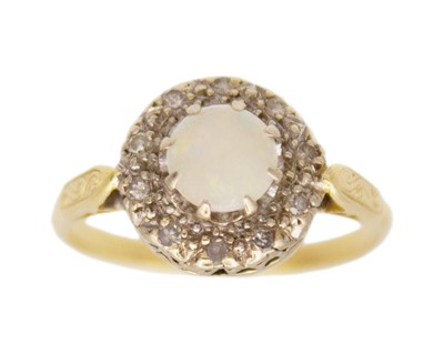 Lot 252 - An early 20th-century white opal and diamond cluster ring, set in 18 yellow and white gold.