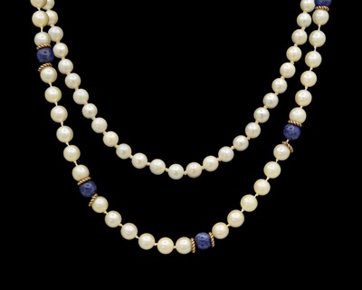Lot 256 - Two cultured pearl necklaces, one with lapis lazuli beads, with 9k clasps.