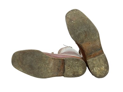 Lot 50 - A pair of brown leather military or riding boots.