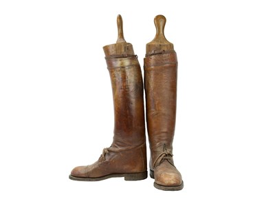Lot 50 - A pair of brown leather military or riding boots.