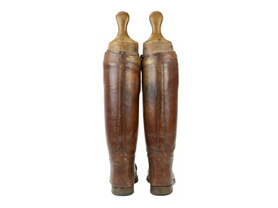 Lot 50 - A pair of brown leather military or riding boots.