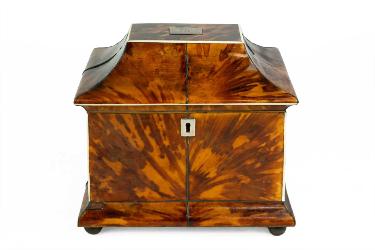 Lot A Regency tortoiseshell tea caddy.