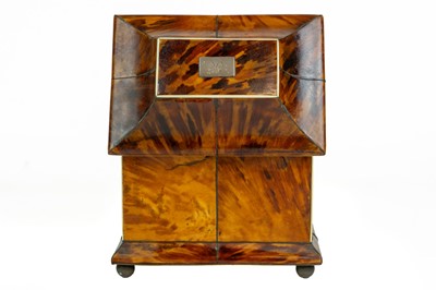 Lot A Regency tortoiseshell tea caddy.
