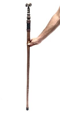 Lot 187 - An unusual walking stick, the iron finial...