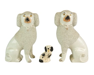 Lot 502 - A pair of Victorian Staffordshire pottery poodles.