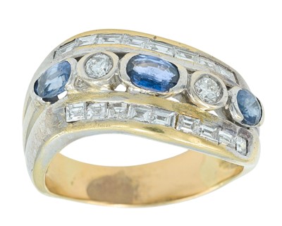 Lot 264 - A white gold diamond and sapphire set dress ring, set in high-purity white gold.