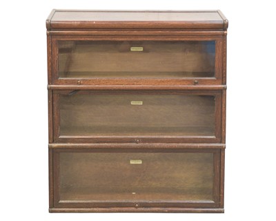 Lot 870 - An oak Globe Wernicke three-section bookcase.
