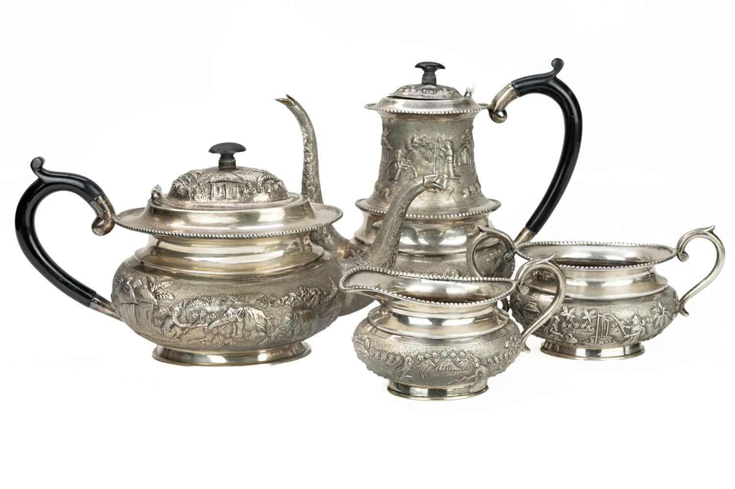 Lot 415 - An Indian Sterling silver four piece tea set.