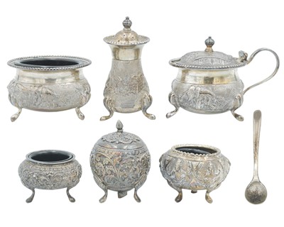 Lot 440 - An Indian Sterling silver three piece cruet set.