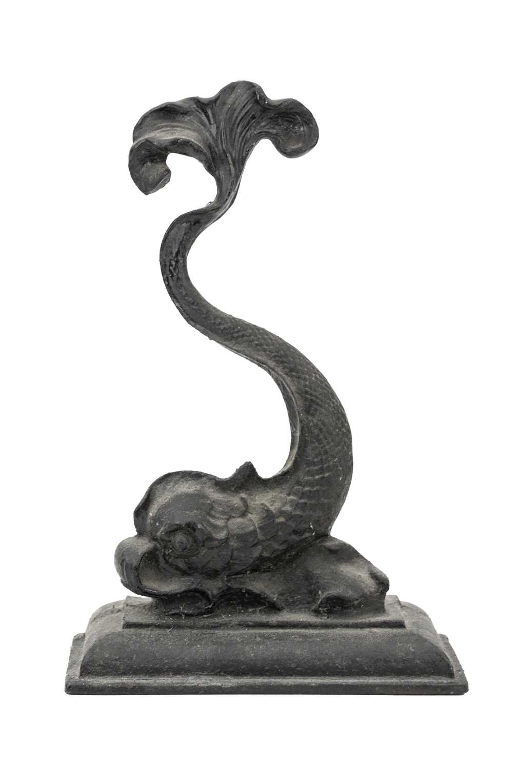 Lot 14 - A Victorian black painted cast iron door stop in the form of a stylised dolphin.