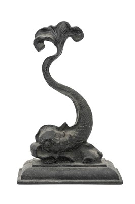 Lot 14 - A Victorian black painted cast iron door stop in the form of a stylised dolphin.