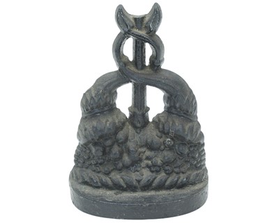 Lot 14 - A Victorian black painted cast iron door stop in the form of a stylised dolphin.