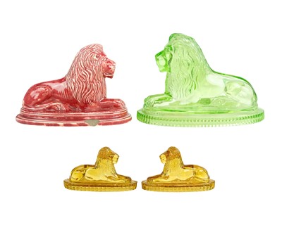 Lot 562 - A late 19th century John Derbyshire press-moulded uranium glass sculpture of a recumbent lion.